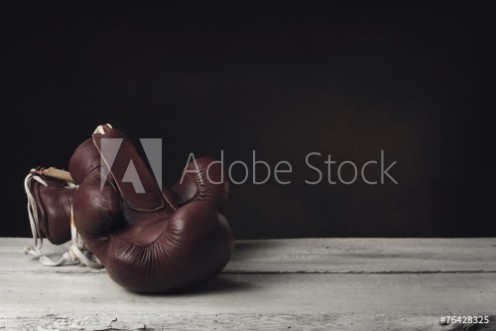 Picture of Boxing Gloves lying on wooden Planks